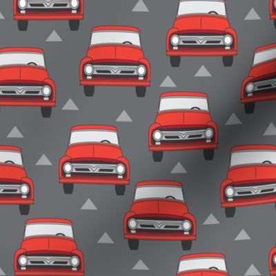vintage red trucks on charcoal