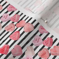 valentines day heart candy - conversation hearts on  stripes (red)