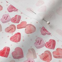 valentines day heart candy - conversation hearts on pink spots (red)