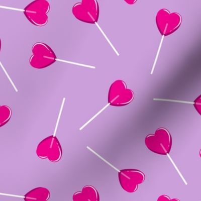 heart shaped suckers - lollipops on purple