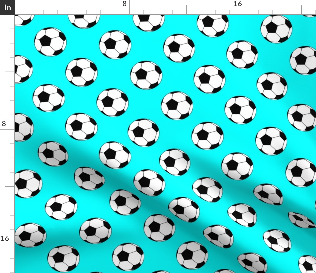 Two Inch Black and White Soccer Balls on Aqua Blue