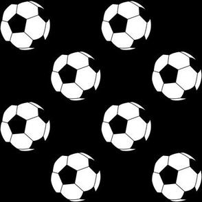 Two Inch Black and White Soccer Balls on Black