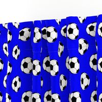 Two Inch Black and White Soccer Balls on Blue