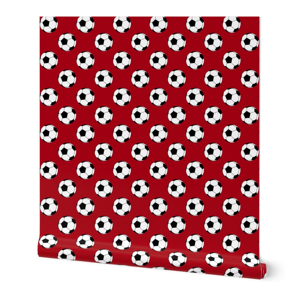 Two Inch Black and White Soccer Balls on Dark Red