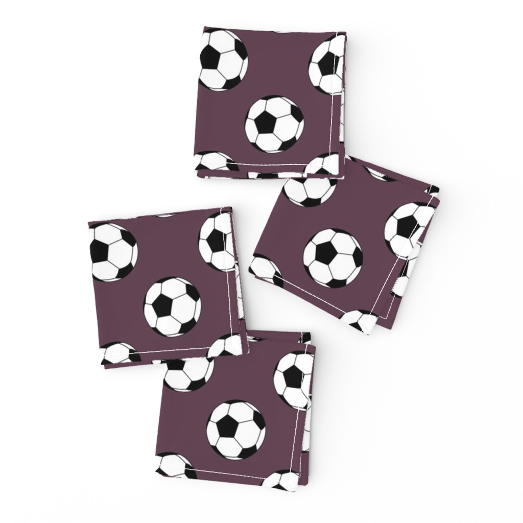 Two Inch Black and White Soccer Balls on Eggplant Purple