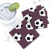 Two Inch Black and White Soccer Balls on Eggplant Purple