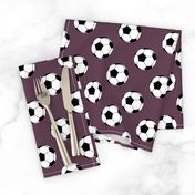 Two Inch Black and White Soccer Balls on Eggplant Purple