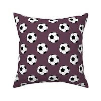 Two Inch Black and White Soccer Balls on Eggplant Purple