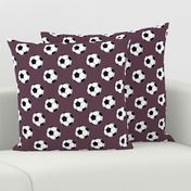 Two Inch Black and White Soccer Balls on Eggplant Purple