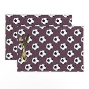 Two Inch Black and White Soccer Balls on Eggplant Purple