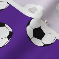 Two Inch Black and White Soccer Balls on Purple