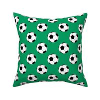 Two Inch Black and White Soccer Balls on Shamrock Green