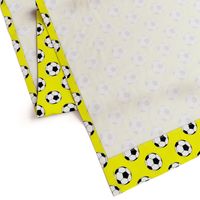 Two Inch Black and White Soccer Balls on Yellow