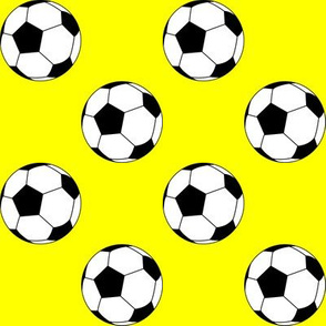 Two Inch Black and White Soccer Balls on Yellow