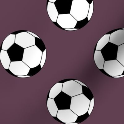 Three Inch Black and White Soccer Balls on Eggplant Purple