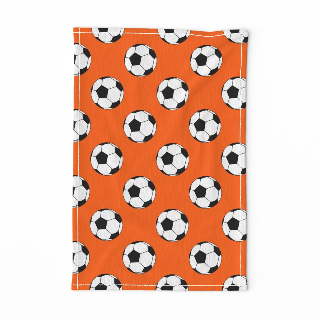 Three Inch Black and White Soccer Balls on Orange