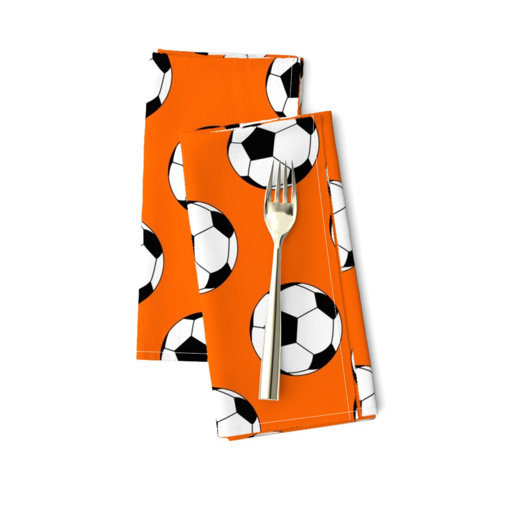 Three Inch Black and White Soccer Balls on Orange