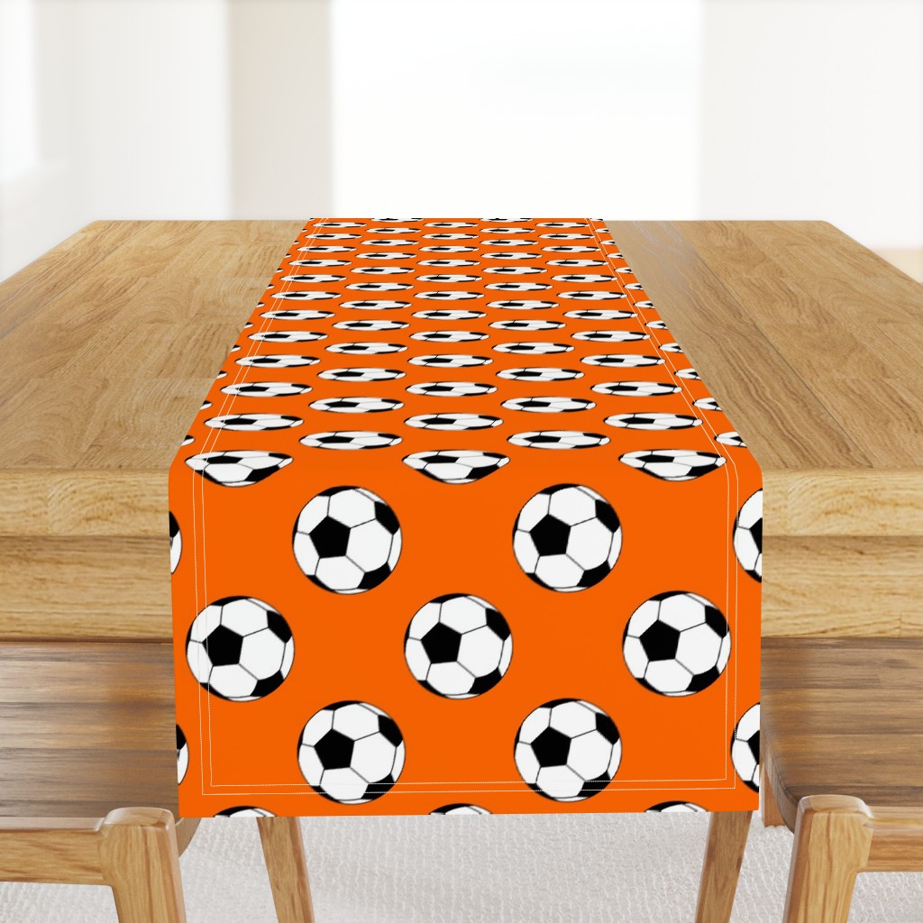 Three Inch Black and White Soccer Balls on Orange