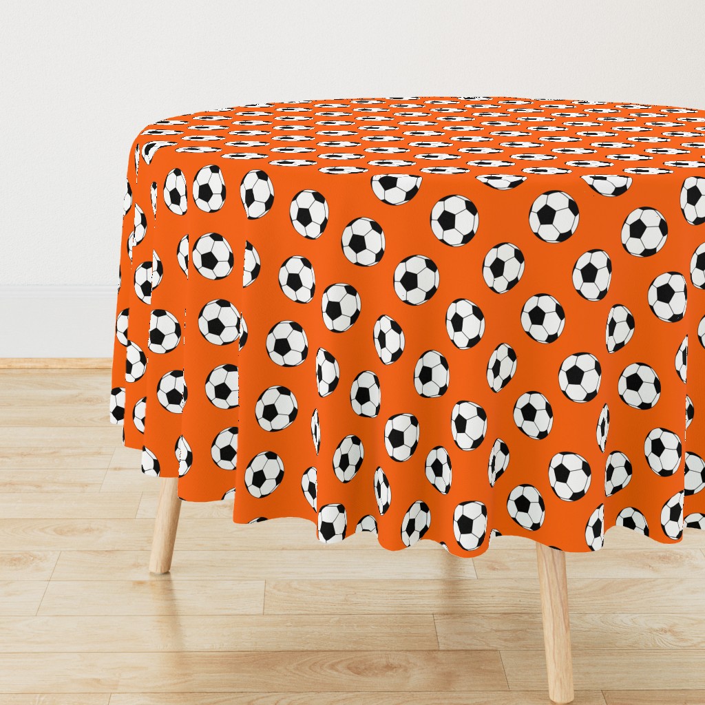 Three Inch Black and White Soccer Balls on Orange