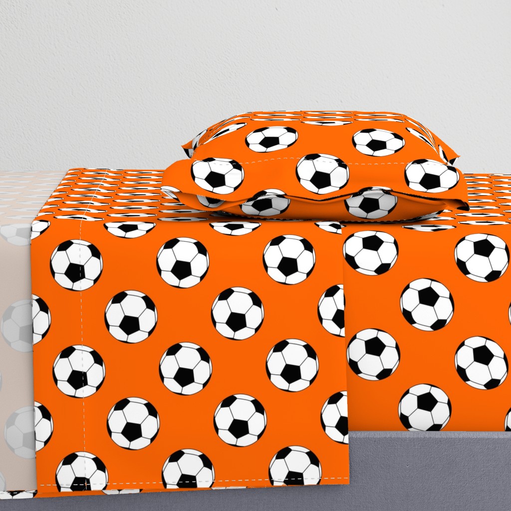 Three Inch Black and White Soccer Balls on Orange