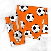 Three Inch Black and White Soccer Balls on Orange