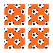 Three Inch Black and White Soccer Balls on Orange