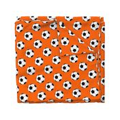 Three Inch Black and White Soccer Balls on Orange