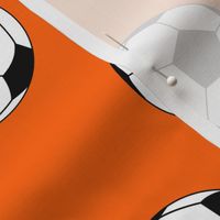 Three Inch Black and White Soccer Balls on Orange