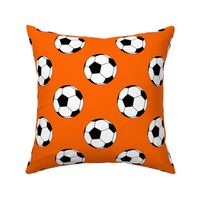 Three Inch Black and White Soccer Balls on Orange