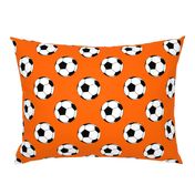 Three Inch Black and White Soccer Balls on Orange