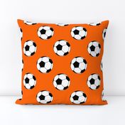 Three Inch Black and White Soccer Balls on Orange