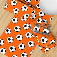 Three Inch Black and White Soccer Balls on Orange