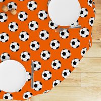 Three Inch Black and White Soccer Balls on Orange