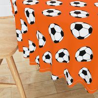 Three Inch Black and White Soccer Balls on Orange