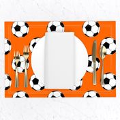 Three Inch Black and White Soccer Balls on Orange