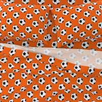 Three Inch Black and White Soccer Balls on Orange