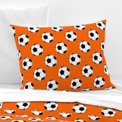 Three Inch Black and White Soccer Balls on Orange