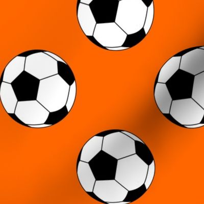 Three Inch Black and White Soccer Balls on Orange