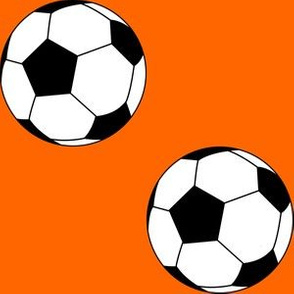 Three Inch Black and White Soccer Balls on Orange