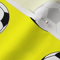 Three Inch Black and White Soccer Balls on Yellow