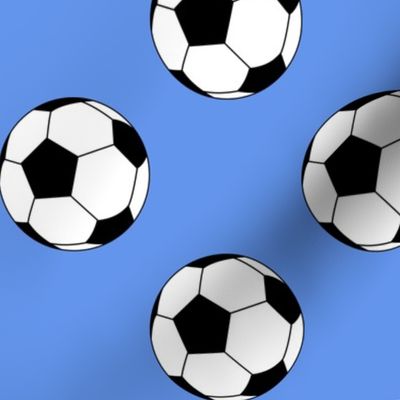 Three Inch Black and White Soccer Balls on Cornflower Blue