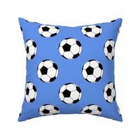 Three Inch Black and White Soccer Balls on Cornflower Blue