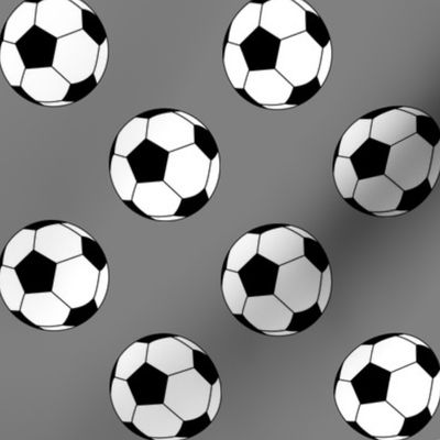 Two Inch Black and White Soccer Balls on Medium Gray