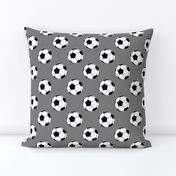 Two Inch Black and White Soccer Balls on Medium Gray