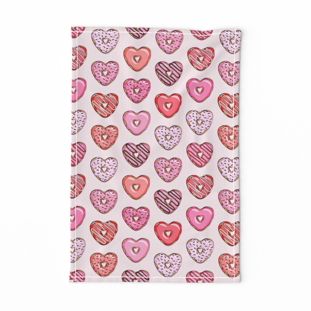 heart shaped donuts - valentines red and pink on light pink