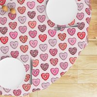 heart shaped donuts - valentines red and pink on light pink