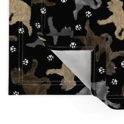 Trotting Pyrenean Shepherds rough face and paw prints - black