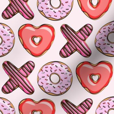 XO heart shaped donuts - valentines red and pink on pink 