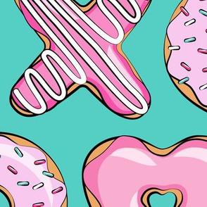 (jumbo scale) X O  heart shaped donuts - xo heart donuts on dark teal 