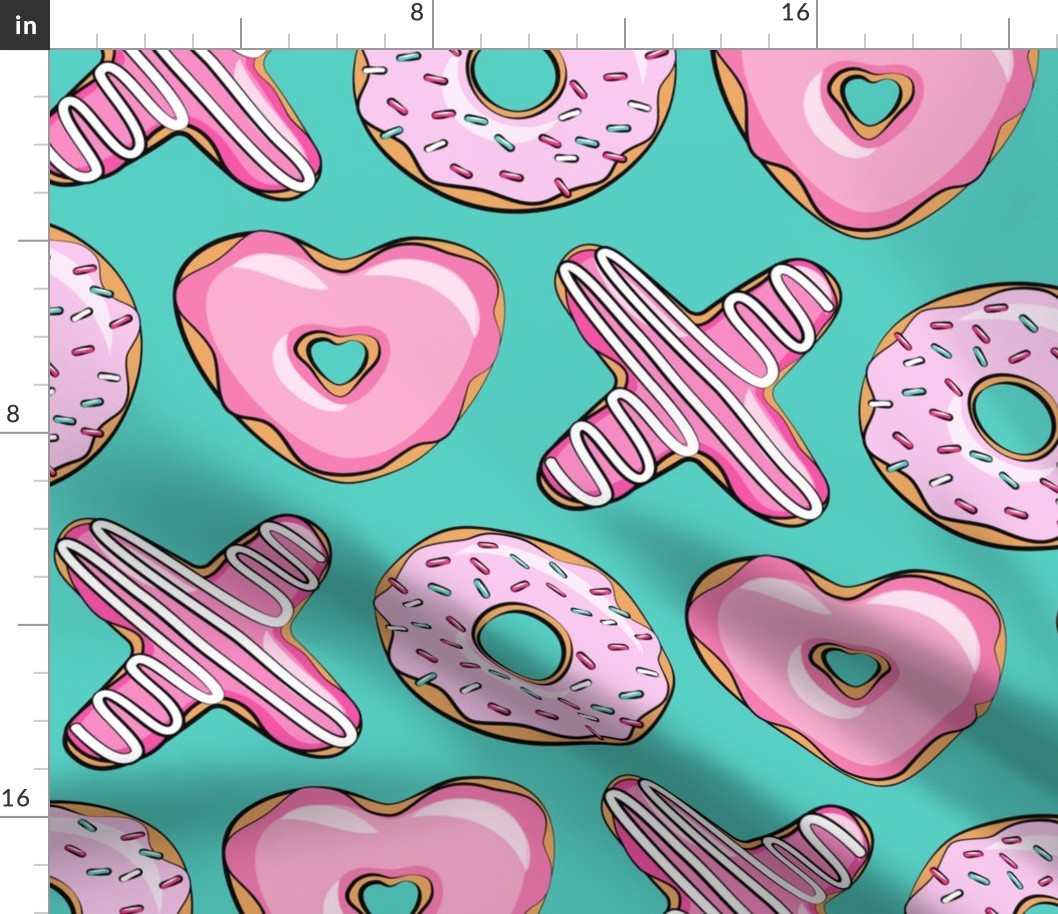 (jumbo scale) X O  heart shaped donuts - xo heart donuts on dark teal 